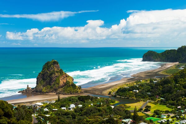  Black -sand surfing in Piha , places to visit in New Zealand  